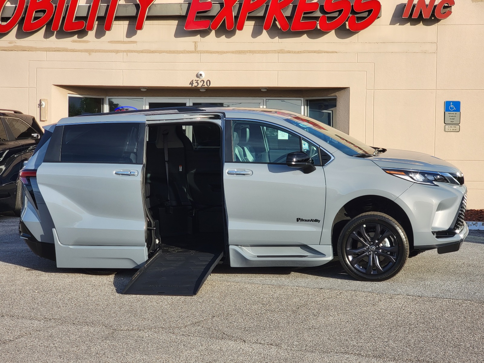A wheelchair accessible van in a scenic background.