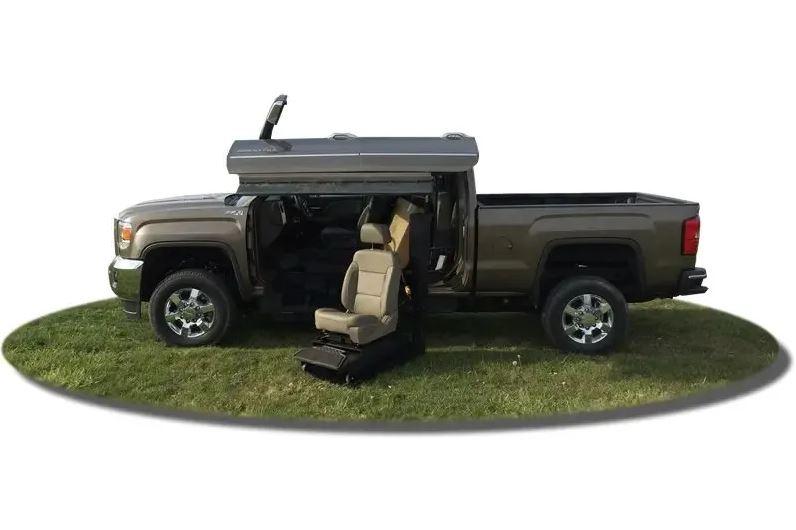 ATC Conversions Chevrolet Silverado 2500 Wheelchair Accessible truck with lift deployed from driver door.