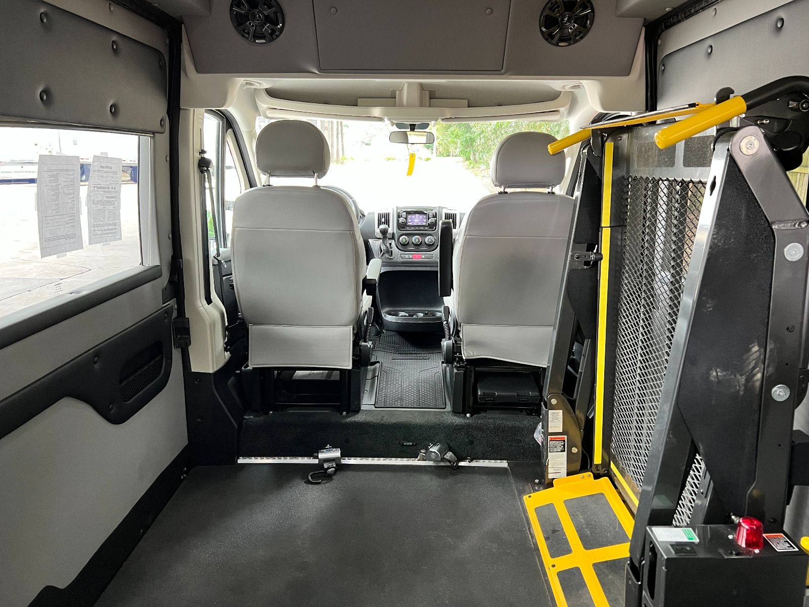 Interior of RAM ProMaster Full Size Wheelchair Van with Tempest X-HT conversion. Interior showing lift and back of front seats of Ram ProMaster Full Size Wheelchair Van with Tempest X-HT Conversion