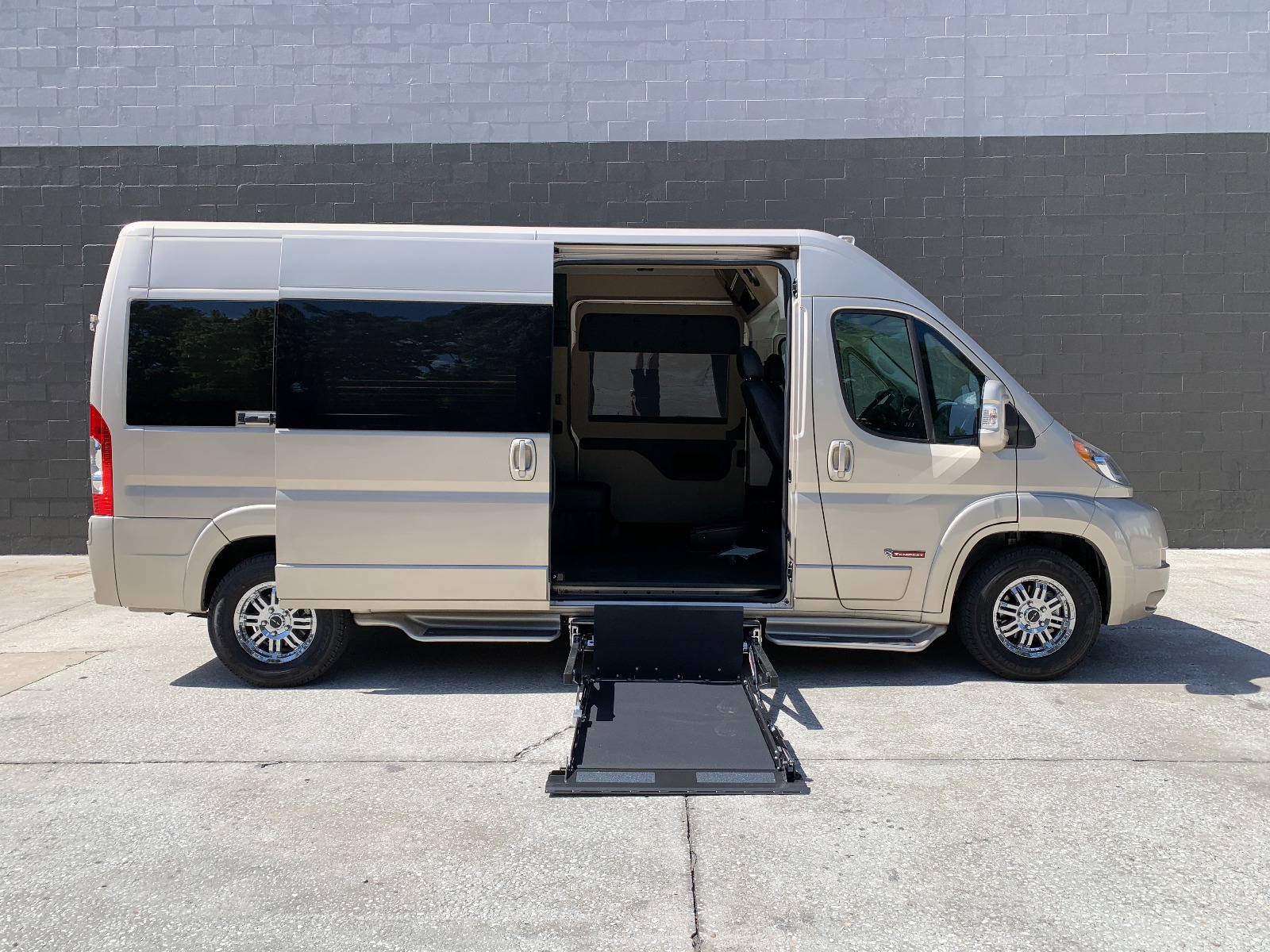 Ram ProMaster Full Size Wheelchair Van with Tempest XL-HT Conversion, with lift deployed from passenger side sliding door.